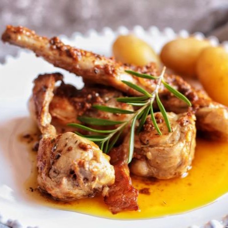 A plate of Conejo en Salmorejo, a traditional Canarian dish.